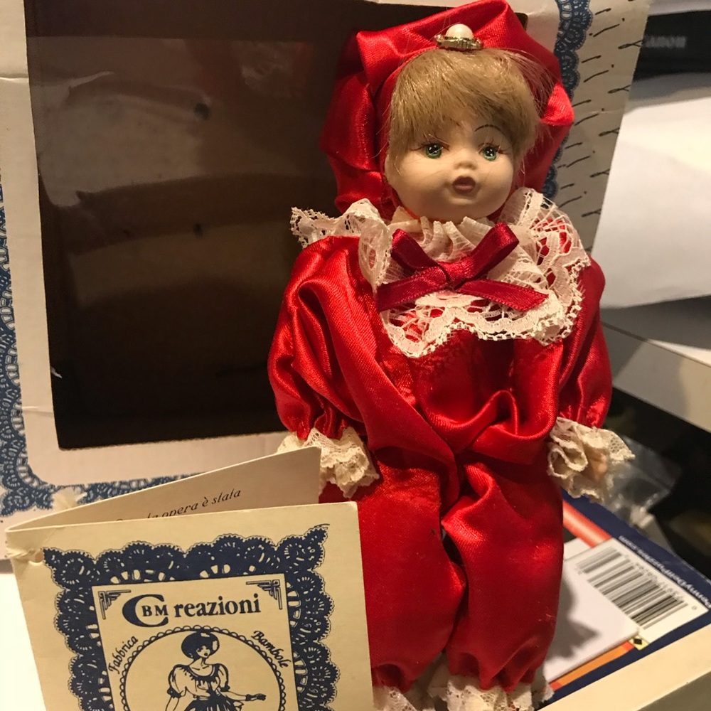 Porcelain doll made in Italy with cog